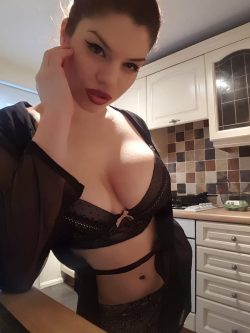 Lucia Love in kitchen wearing lingerie