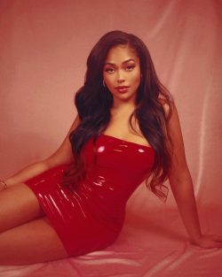 Jordyn Woods in red latex mini dress