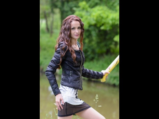 18yo teen camgirl AmyJolie with wavy brown hair & in leather vest & little skirt