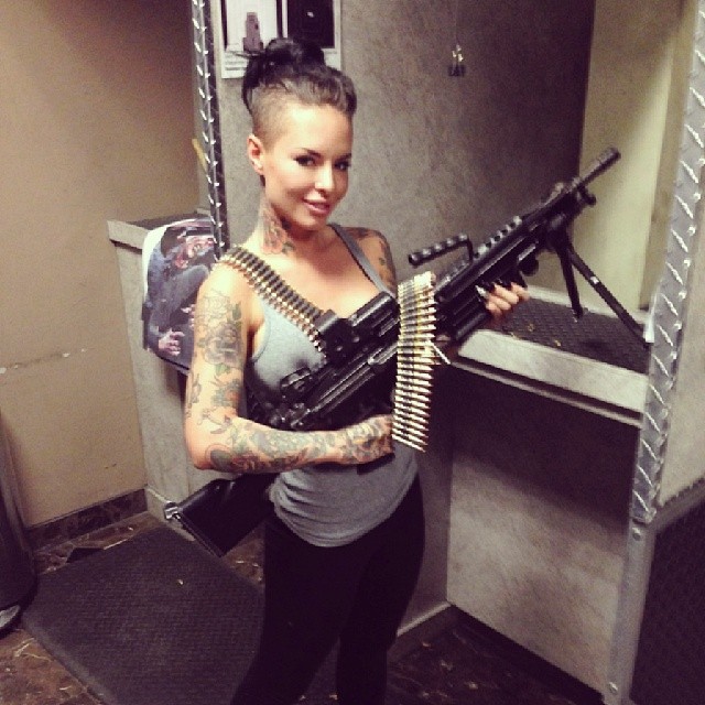 Christy Mack with big machine gun at the shooting range