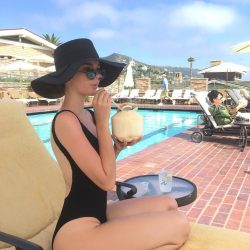 celebrity Maia Mitchell in black swimsuit