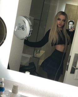 celebrity Dove Cameron shows her bare midriff in selfie